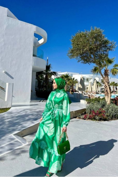 Long dress with high collar and green motif