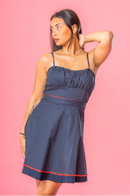 Short dress with red piping and blue strapless polka dots