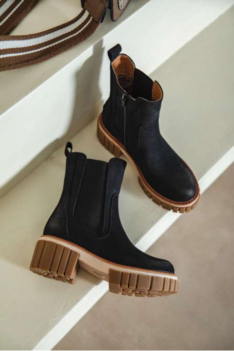 Black thick-soled Chelsea boots