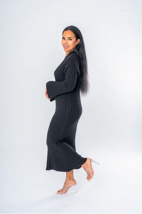 Black long sweater dress with round neck and flared sleeves
