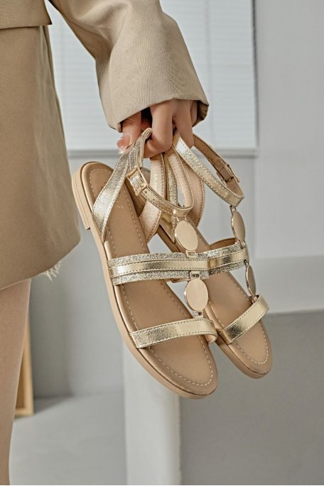 Two-tone flat sandals with gold roundel and gold straps